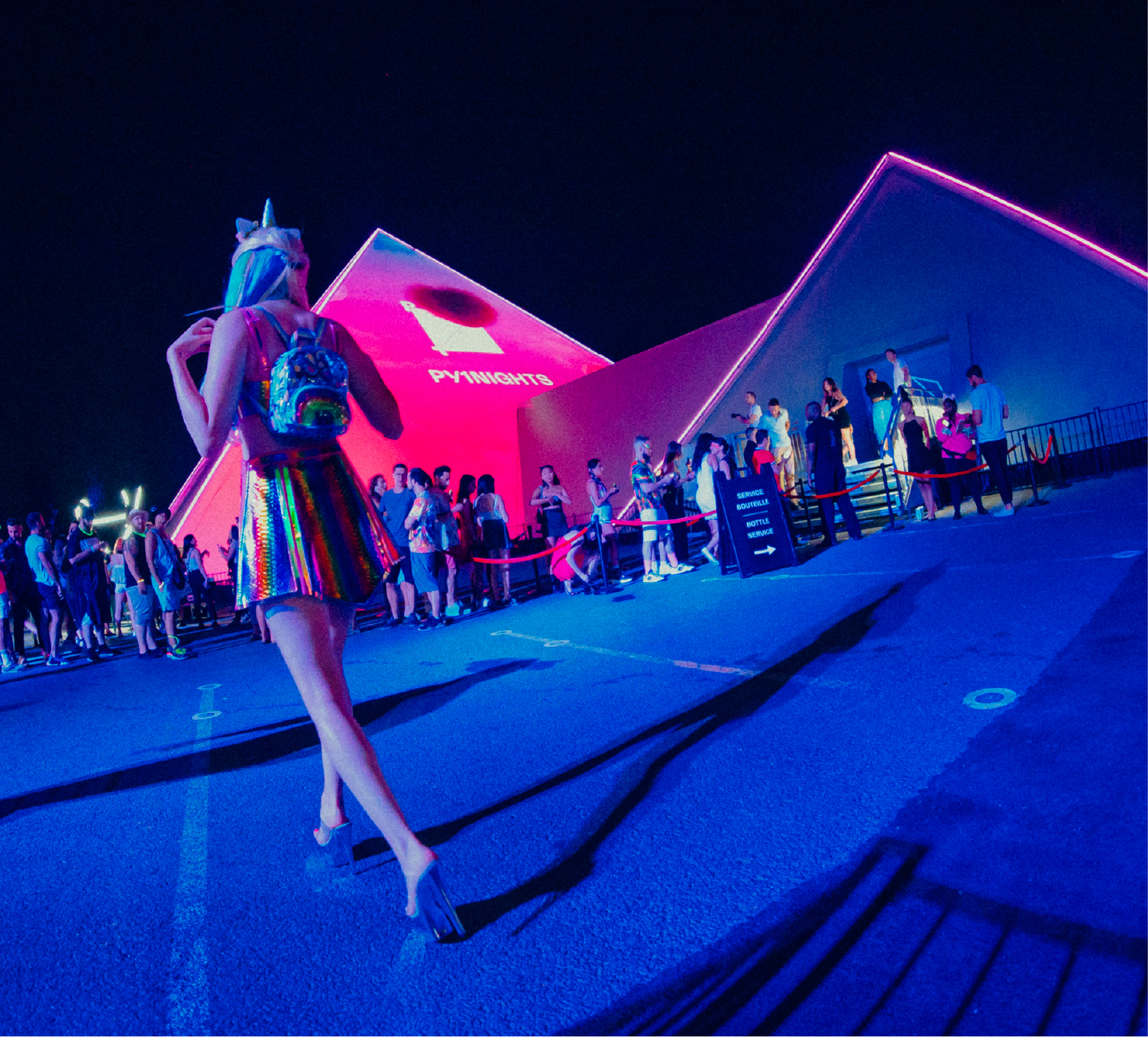 Woman walking towards the PY1 pyramid for Candy World