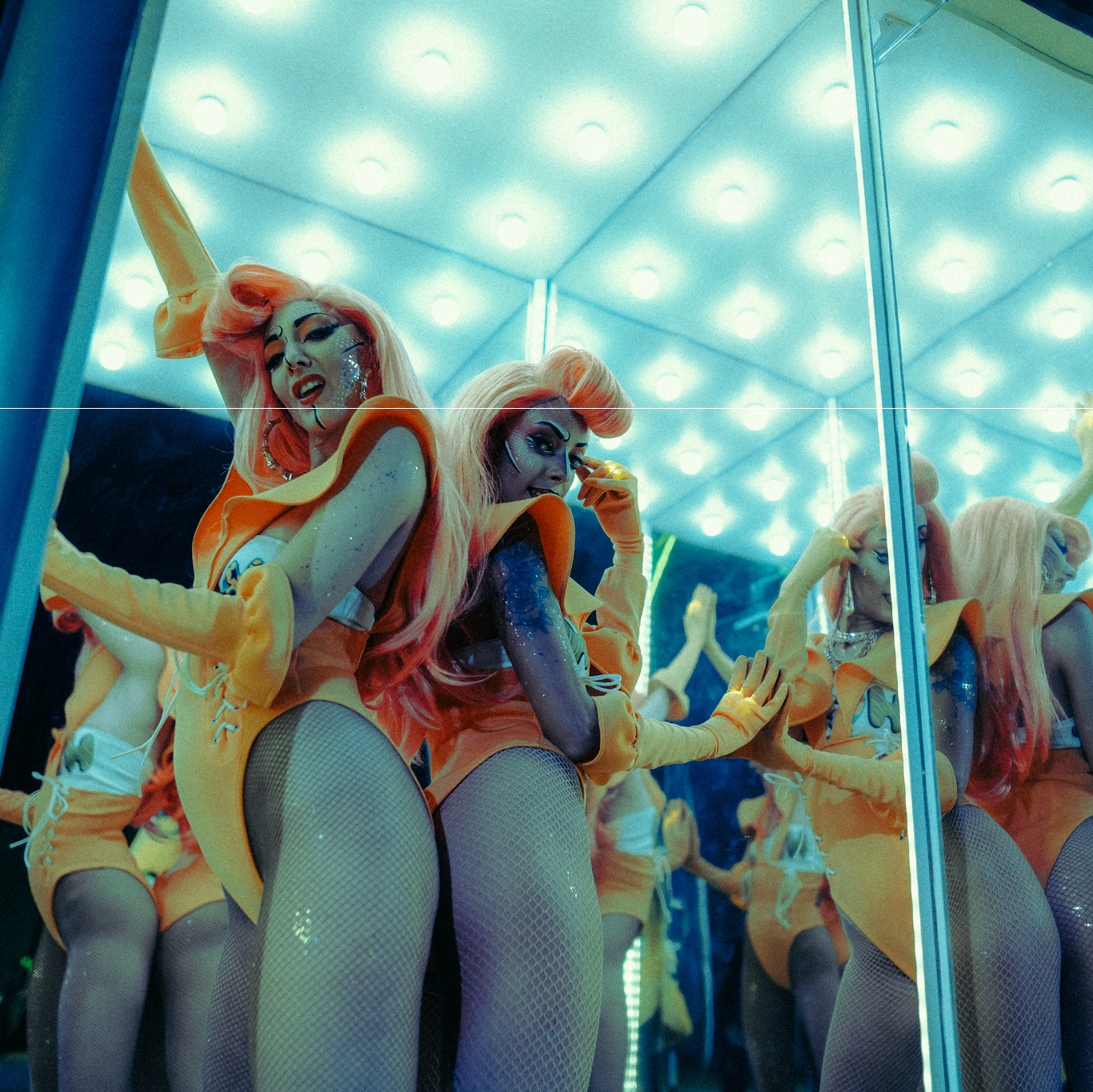 Woman dressed in colorful suit and blond wig